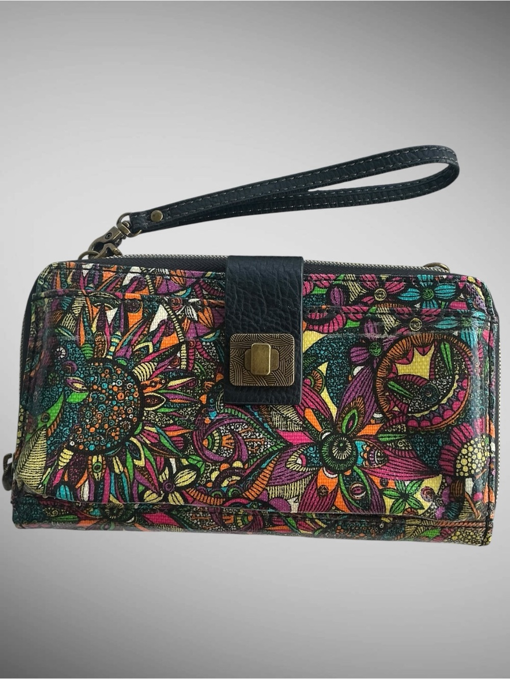 Sakroots large envelope wristlet in coated canvas Rainbow Desert Spirit pattern